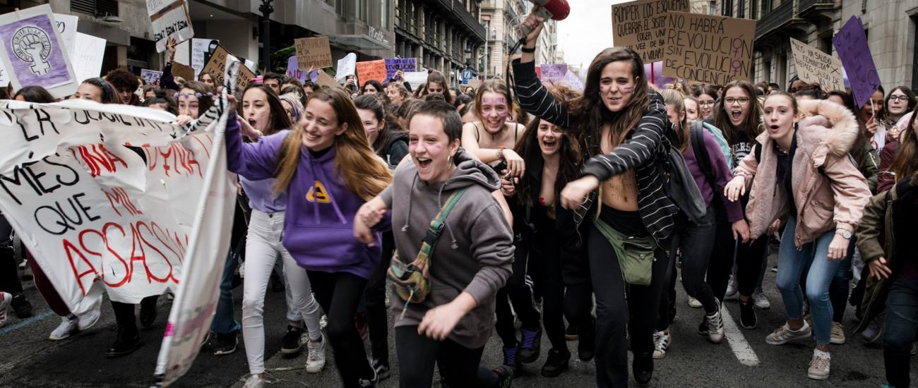 Women running at femicide protest