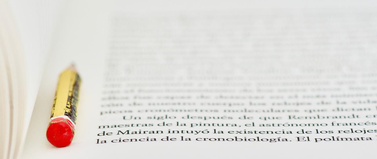 open book page with text and crayon