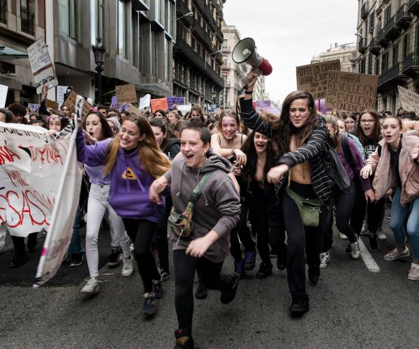 Women running at femicide protest